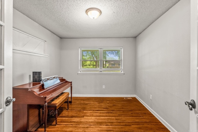 7110 Forest Dale Dr, North Little Rock, AR 72118 - office featuring wood finished floors, a textured ceiling, and baseboards