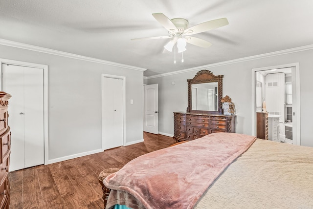 7110 Forest Dale Dr, North Little Rock, AR 72118 - bedroom with ornamental molding, wood finished floors, two closets, baseboards, and ensuite bathroom