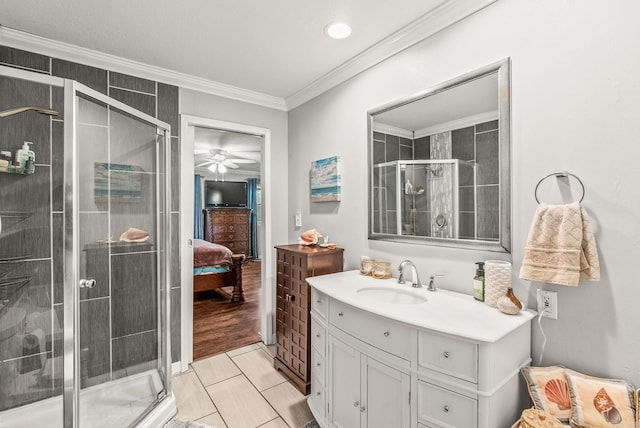 7110 Forest Dale Dr, North Little Rock, AR 72118 - ensuite bathroom featuring a stall shower, vanity, ornamental molding, a ceiling fan, and tile patterned flooring