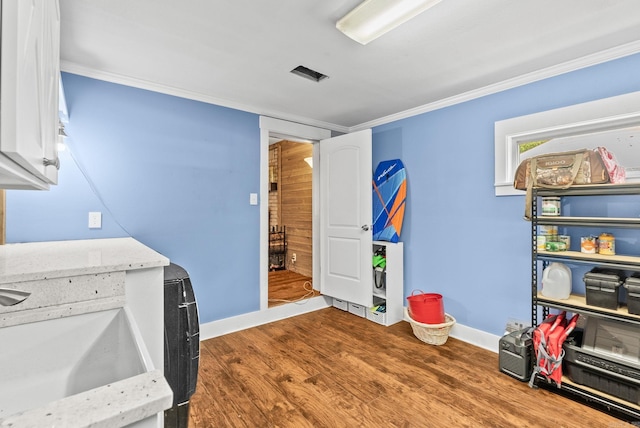 7110 Forest Dale Dr, North Little Rock, AR 72118 - office area with wood finished floors, a sink, baseboards, and ornamental molding