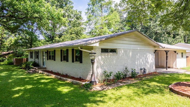 7110 Forest Dale Dr, North Little Rock, AR 72118 - view of side of property featuring a yard and brick siding
