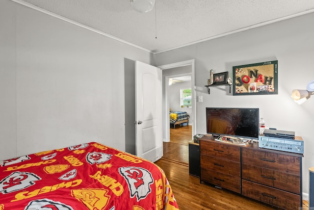 7110 Forest Dale Dr, North Little Rock, AR 72118 - bedroom with wood finished floors, crown molding, and a textured ceiling
