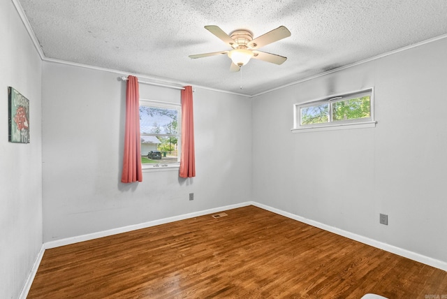 7110 Forest Dale Dr, North Little Rock, AR 72118 - unfurnished room featuring wood finished floors, a textured ceiling, ornamental molding, ceiling fan, and baseboards