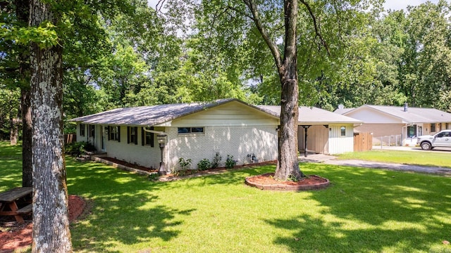 7110 Forest Dale Dr, North Little Rock, AR 72118 - ranch-style house featuring brick siding, asphalt driveway, and a carport