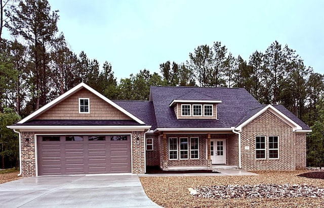 107 Elcano Dr, Hot Springs Village, AR 71909 - view of front of house featuring brick siding, concrete driveway, a garage, and a shingled roof