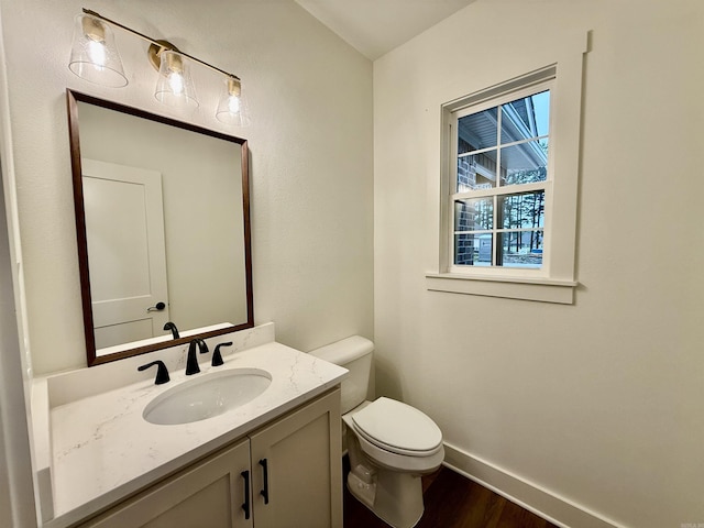 107 Elcano Dr, Hot Springs Village, AR 71909 - half bathroom with wood finished floors, toilet, vanity, and baseboards