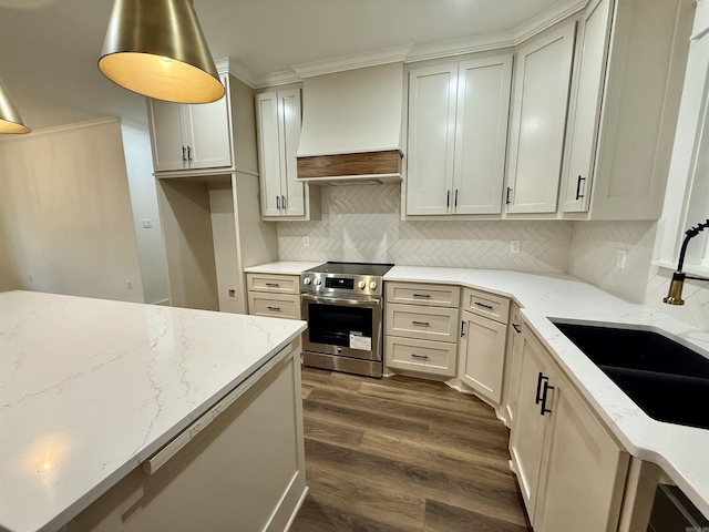 107 Elcano Dr, Hot Springs Village, AR 71909 - kitchen with stainless steel range with electric cooktop, custom exhaust hood, ornamental molding, dark wood-style flooring, and light stone countertops