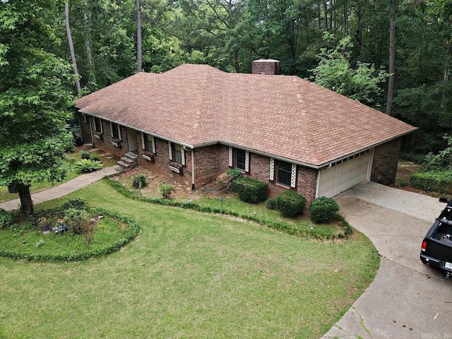 view from above of property with a heavily wooded area