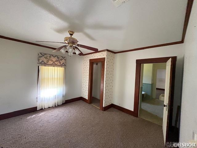 405 3rd Ave, Murfreesboro, AR 71958 - empty room with crown molding, carpet flooring, baseboards, and a ceiling fan