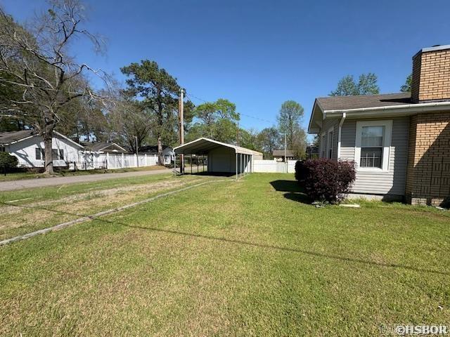 405 3rd Ave, Murfreesboro, AR 71958 - view of yard with a carport