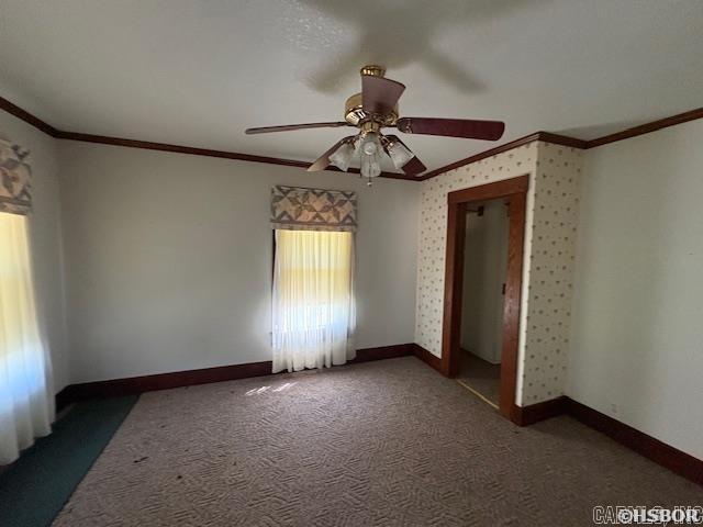 405 3rd Ave, Murfreesboro, AR 71958 - carpeted spare room with crown molding, a ceiling fan, and baseboards