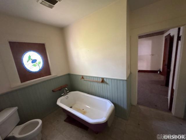 405 3rd Ave, Murfreesboro, AR 71958 - bathroom with wainscoting and toilet