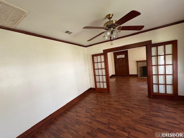 405 3rd Ave, Murfreesboro, AR 71958 - unfurnished room featuring dark wood-style floors, baseboards, ceiling fan, ornamental molding, and french doors