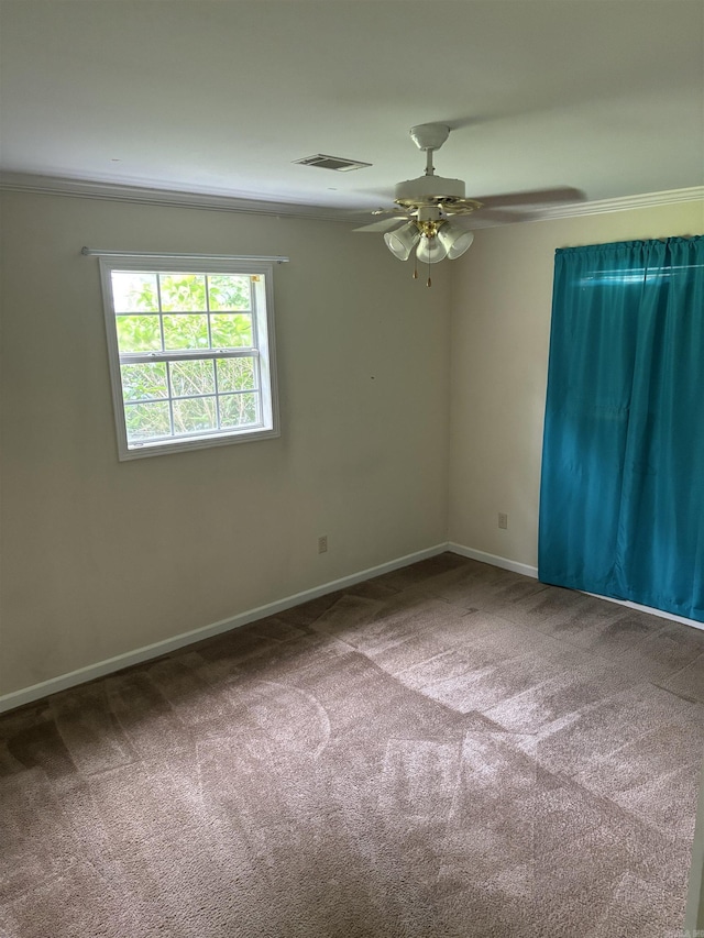 1006 Austin St, Camden, AR 71701 - carpeted empty room with a ceiling fan, baseboards, and ornamental molding