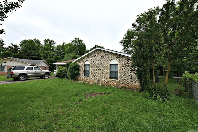 514 Proft Cir, Mena, AR 71953 - view of property exterior featuring brick siding and driveway