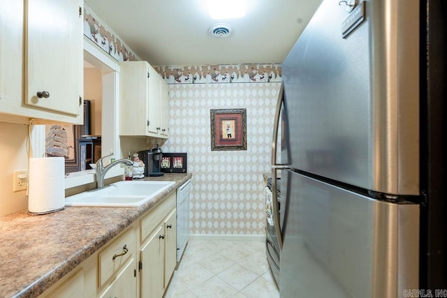 135 Hillview # 38, Fairfield Bay, AR 72088 - kitchen with freestanding refrigerator, wallpapered walls, a sink, white dishwasher, and light countertops