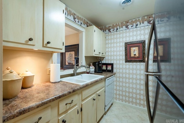 135 Hillview # 38, Fairfield Bay, AR 72088 - kitchen featuring a sink, freestanding refrigerator, white dishwasher, wallpapered walls, and baseboards