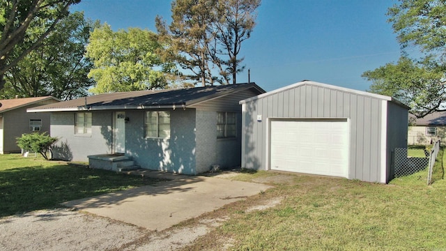 312 S Crossroads, Portia, AR 72457 - view of front of property featuring a front yard, concrete driveway, an outbuilding, and brick siding
