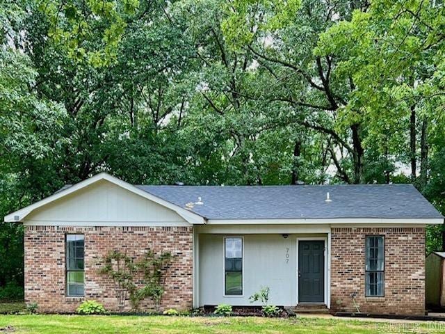 707 Maple, Forrest City, AR 72335 - single story home with brick siding and a front lawn