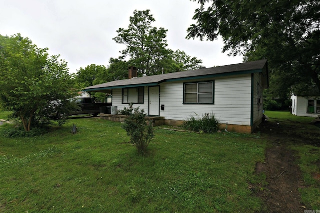 911 Gillham, Mena, AR 71953 - view of front of house featuring a front yard, a porch, and a chimney