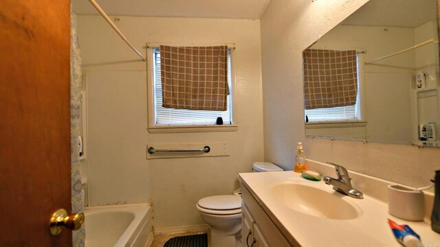 911 Gillham, Mena, AR 71953 - full bath featuring toilet, vanity, and shower / washtub combination