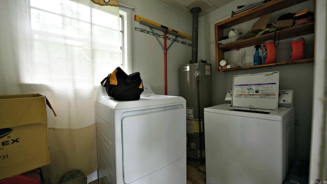 911 Gillham, Mena, AR 71953 - laundry area with water heater and washing machine and dryer