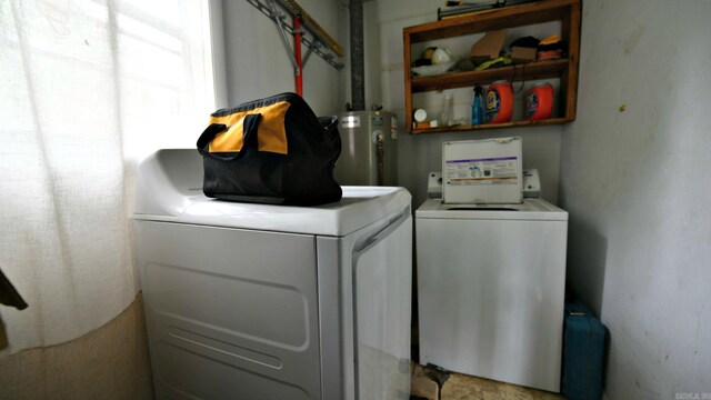 911 Gillham, Mena, AR 71953 - laundry room featuring washing machine and clothes dryer and water heater