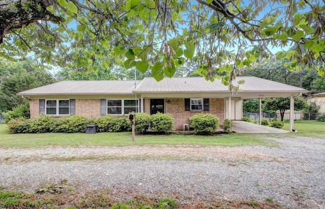 2931 Salem Rd, Benton, AR 72019 - ranch-style home featuring a carport, driveway, brick siding, and metal roof
