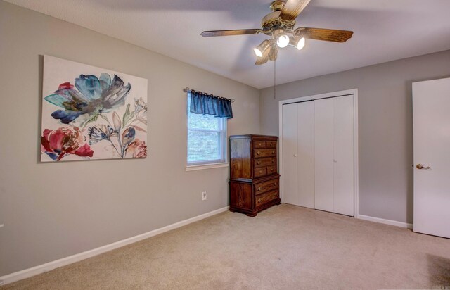 2931 Salem Rd, Benton, AR 72019 - unfurnished bedroom with light colored carpet, baseboards, a ceiling fan, and a closet