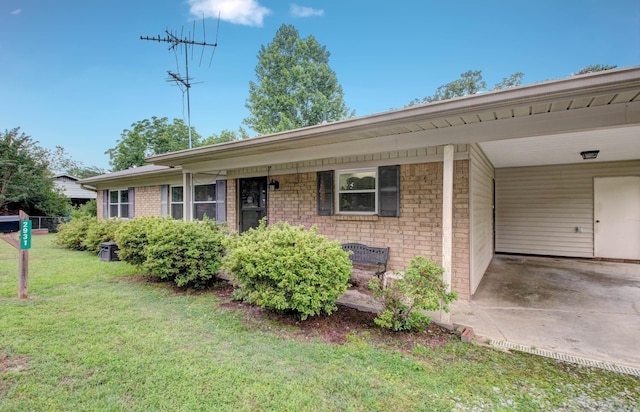 2931 Salem Rd, Benton, AR 72019 - single story home with a front yard, brick siding, and a carport