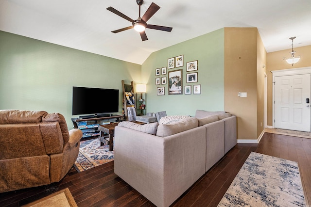 living room featuring a ceiling fan, dark wood-style floors, lofted ceiling, and baseboards