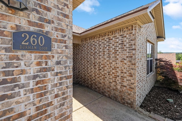 entrance to property with brick siding