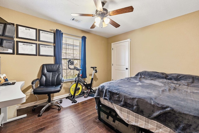 bedroom with hardwood / wood-style flooring, baseboards, and a ceiling fan