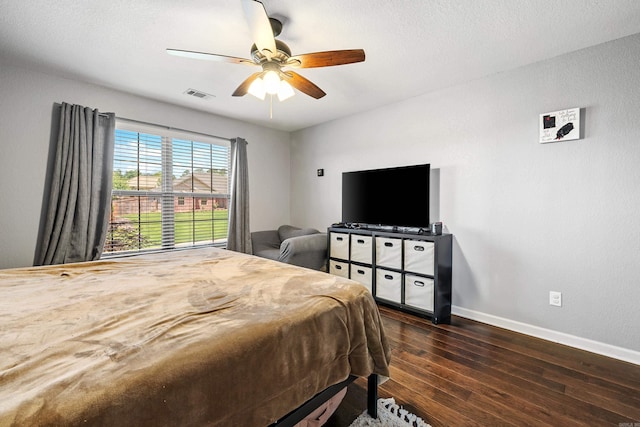 bedroom featuring dark wood-style floors, baseboards, and ceiling fan