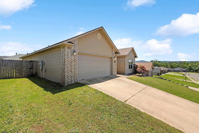 view of front facade with brick siding, a garage, and driveway