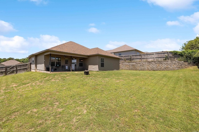 rear view of house with a patio area and a ceiling fan