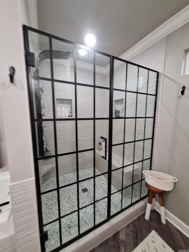 4401 Wagon Trace Cv, White Hall, AR 71602 - bathroom with a shower stall, baseboards, and crown molding
