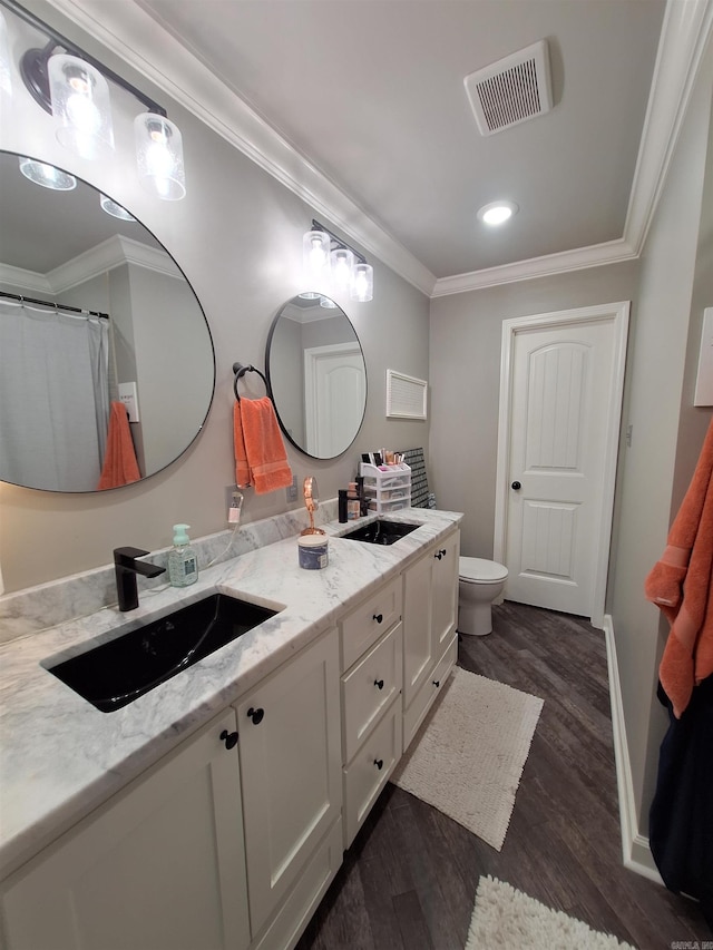 4401 Wagon Trace Cv, White Hall, AR 71602 - full bathroom featuring double vanity, wood finished floors, toilet, crown molding, and recessed lighting