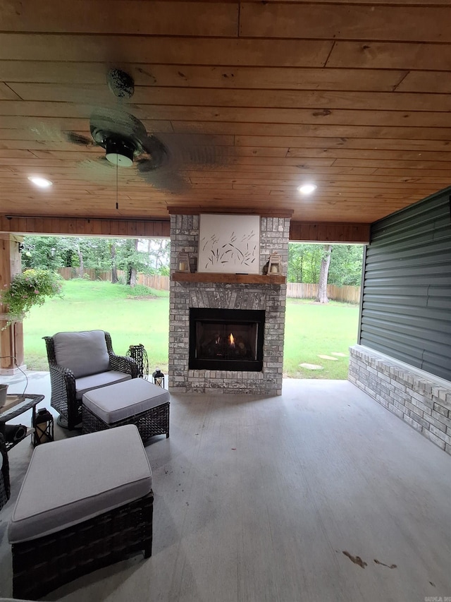 4401 Wagon Trace Cv, White Hall, AR 71602 - view of patio / terrace with a lit fireplace and a ceiling fan