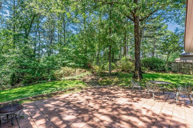 13701 Pleasant Forest Dr, Little Rock, AR 72212 - view of patio / terrace featuring a fire pit and outdoor dining space
