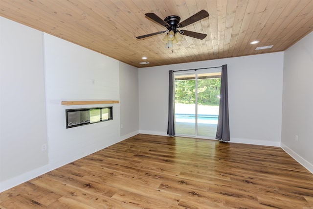 19300 Lake Winona Rd, Paron, AR 72122 - empty room with a glass covered fireplace, wooden ceiling, wood finished floors, a ceiling fan, and recessed lighting