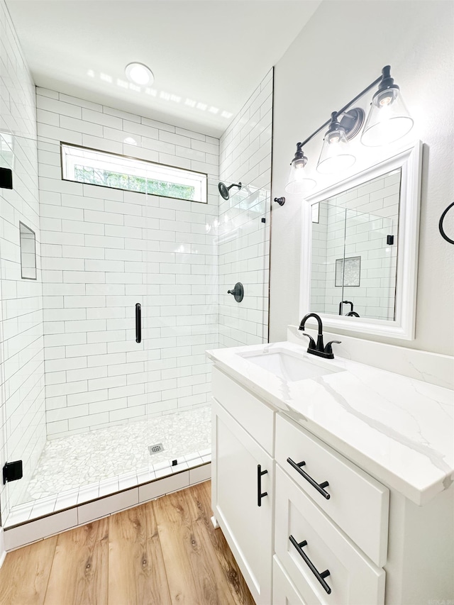 19300 Lake Winona Rd, Paron, AR 72122 - full bath featuring a shower stall, vanity, and wood finished floors
