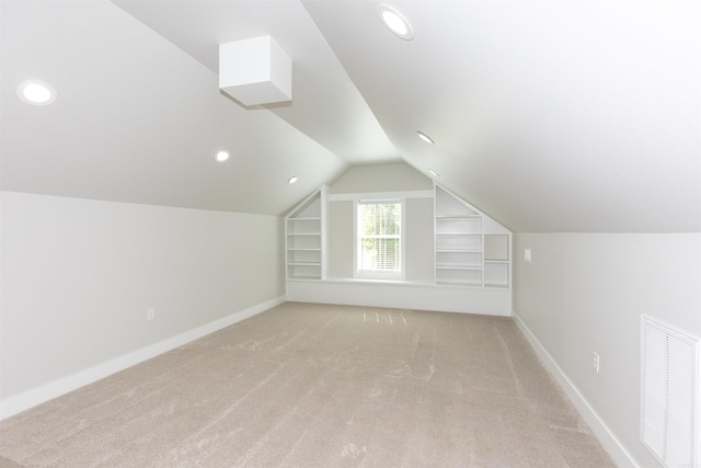 19300 Lake Winona Rd, Paron, AR 72122 - additional living space featuring vaulted ceiling, light colored carpet, built in shelves, baseboards, and recessed lighting