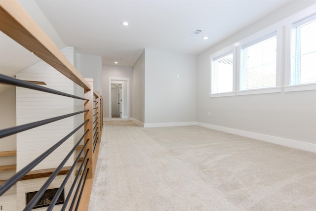 19300 Lake Winona Rd, Paron, AR 72122 - unfurnished room featuring light colored carpet, stairway, recessed lighting, and baseboards