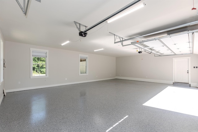 19300 Lake Winona Rd, Paron, AR 72122 - garage with baseboards and a garage door opener
