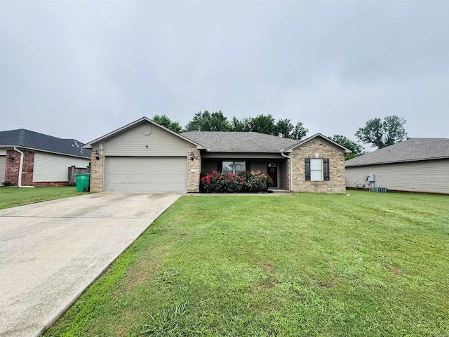 112 Seminole Cir, Austin, AR 72023 - single story home with a garage, concrete driveway, brick siding, and a front lawn