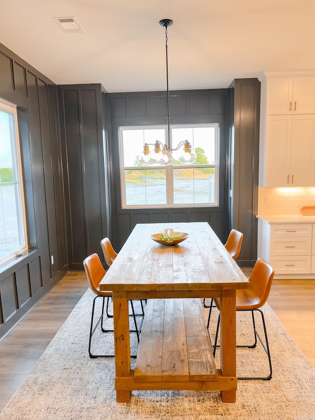 111 Legacy Way, Ward, AR 72176 - dining room featuring light wood-style flooring and a chandelier