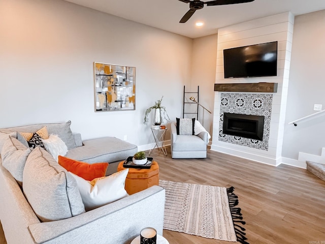 111 Legacy Way, Ward, AR 72176 - living area featuring ceiling fan, wood finished floors, baseboards, a tiled fireplace, and recessed lighting