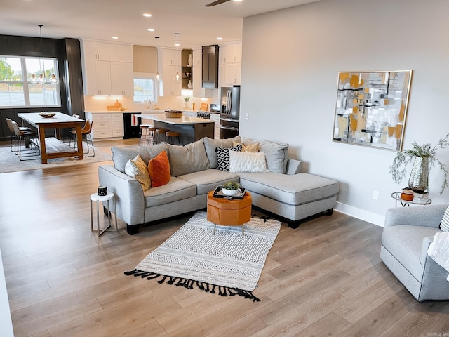 111 Legacy Way, Ward, AR 72176 - living room with light wood-type flooring, recessed lighting, and baseboards