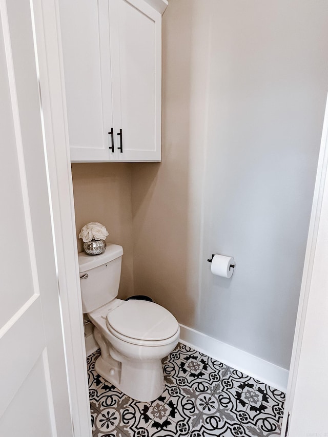 111 Legacy Way, Ward, AR 72176 - bathroom with toilet, baseboards, and tile patterned flooring